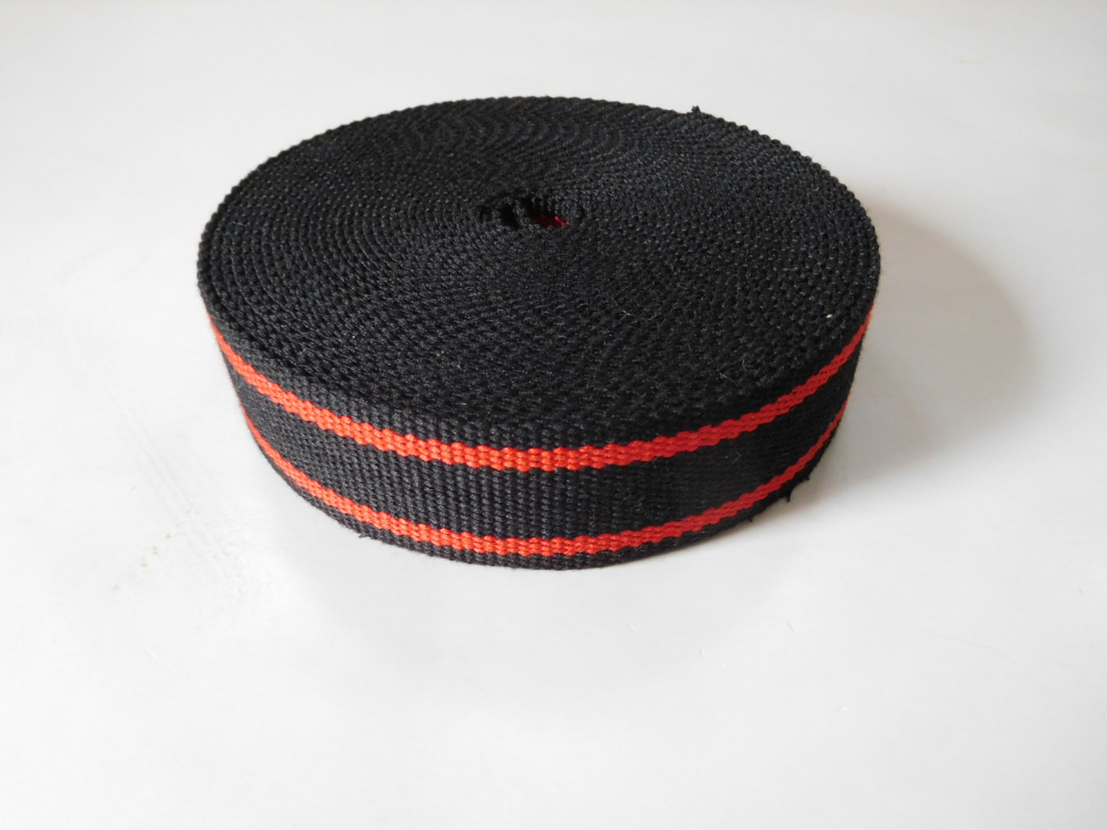 Secondary color aramid fiber webbing for fire safety