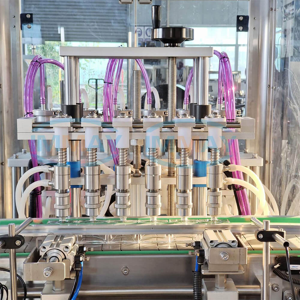 Automatic perfume bottle filler Llenadora automática de botellas de perfume